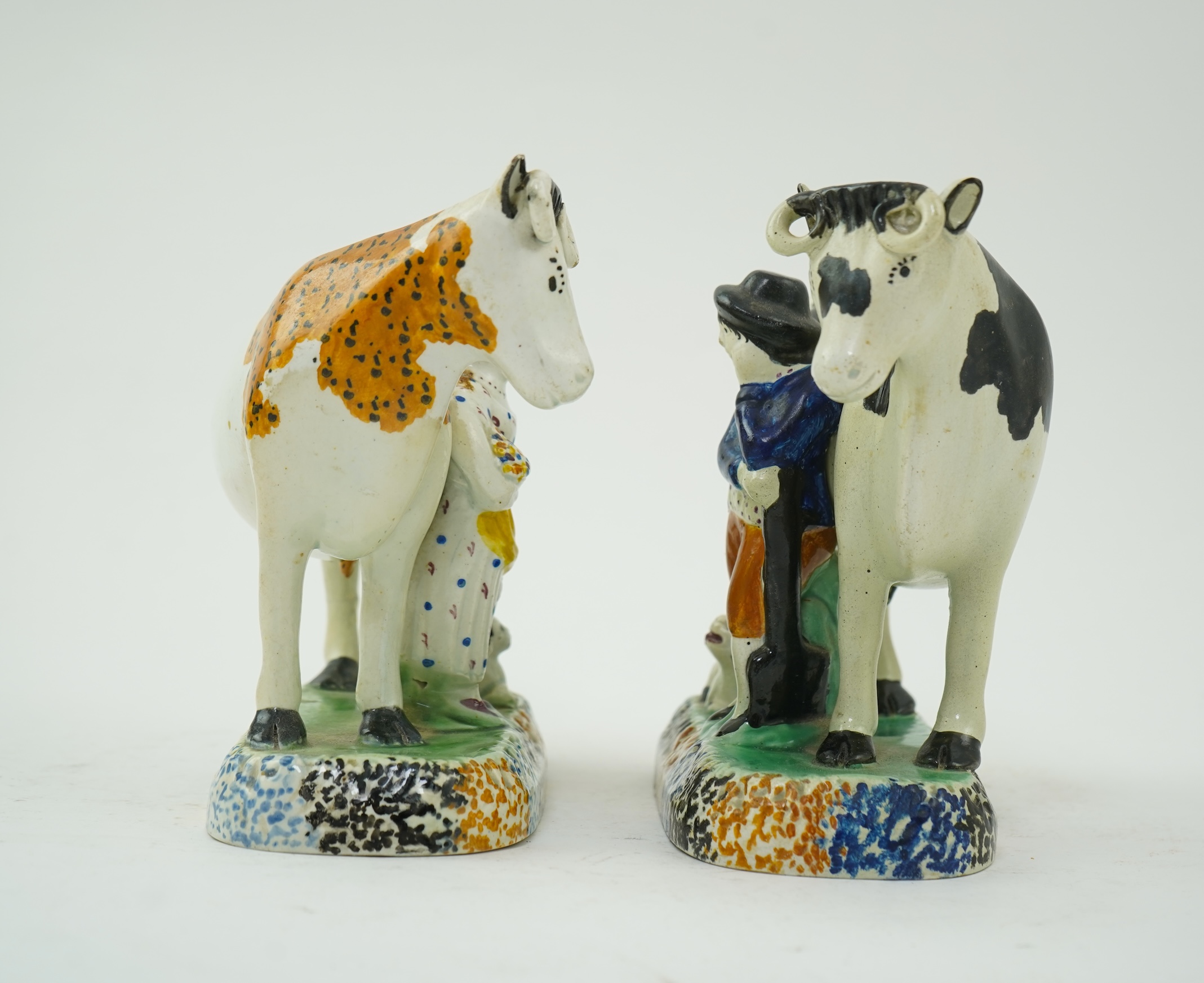 Two Yorkshire Prattware cows, with farmer or milkmaid and dog groups, c.1810